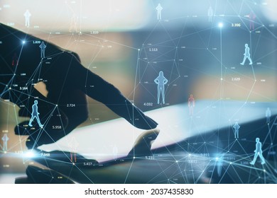 Close up of backlit hand using tablet on desktop with creative glowing connected people icons on blurry background. Population count and digital transformation concept. Double exposure - Shutterstock ID 2037435830