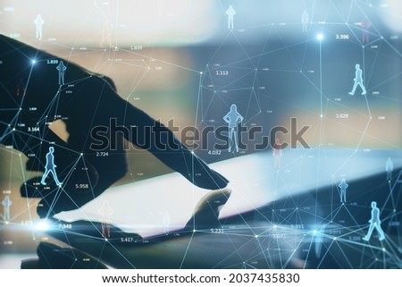 Close up of backlit hand using tablet on desktop with creative glowing connected people icons on blurry background. Population count and digital transformation concept. Double exposure