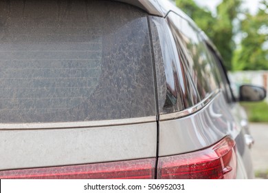 Close Up Backside Of Dirty Car. Car Wash Concept