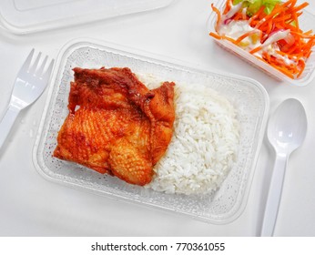 Close Up Baked Rice With Spicy Chicken And Salad In The Tupperware,white Background