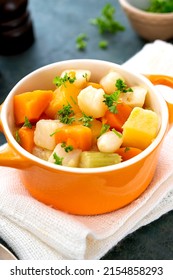 Close Up Baked Root Vegetables In Orange Bowl. Vegan Foods