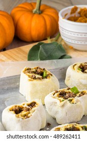 Close Up Of Baking Rack With Ready To Bake Beef Pumpkin Pinwheels.