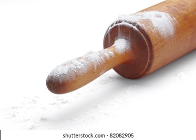 Close Up Of  Baking Rolling Pin And Flour On White Background