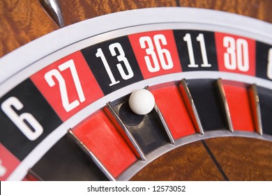 Close up of ball on roulette wheel in number thirteen