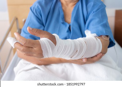 Close Up Of Bandage Patient Arm On A Hospital Bed