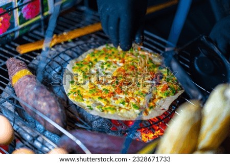 Close up of Banh Trang Nuong Or local vietnam pizza is a popular street food for tourist and people in Da Lat, Vietnam