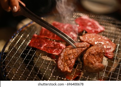 Close up barbecue grilling cow tongue  , cooking yakiniku Japanese style