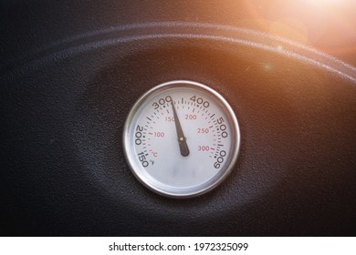 Close Up Of Barbecue Or Smoke Grill Circular Thermometer, Black Surface