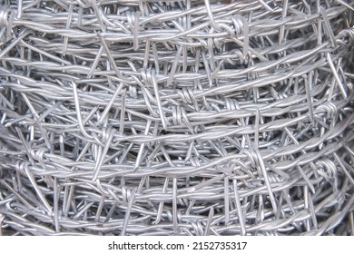 Close Up Barbed Steel Wire Roll Abstract White Grey Background