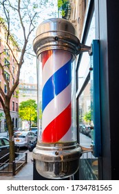 Close Up Of Barber Pole Outside A Small Local Barbershop In New York City