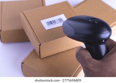 Close up barcode scanner on the package brown box,Inspection of 