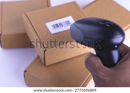 Close up barcode scanner on the package brown box,Inspection of 
