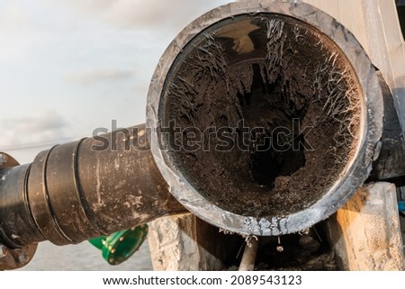 Close up barnacles in the pump suction pipe.