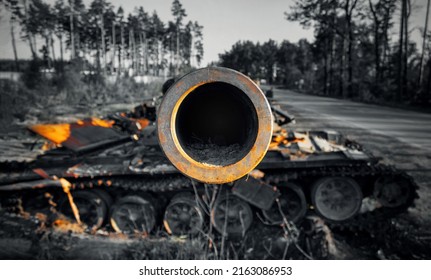 Close up of the barrel of a destroyed Russian tank during the military invasion of Ukraine. Ukraine war. - Shutterstock ID 2163086953