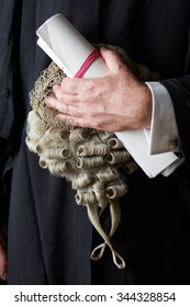 Close Up Of Barrister Holding Brief And Wig