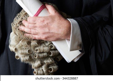Close Up Of Barrister Holding Wig And Brief