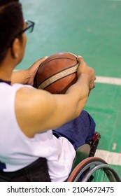 Close Up Of A Basketball Player Holding A Ball