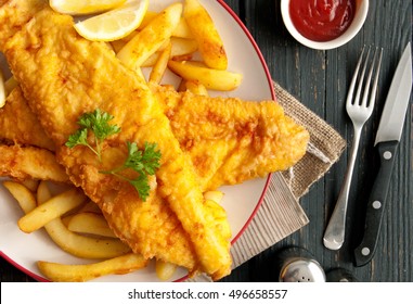 Close Up Of Battered Fish On A Plate With Chips