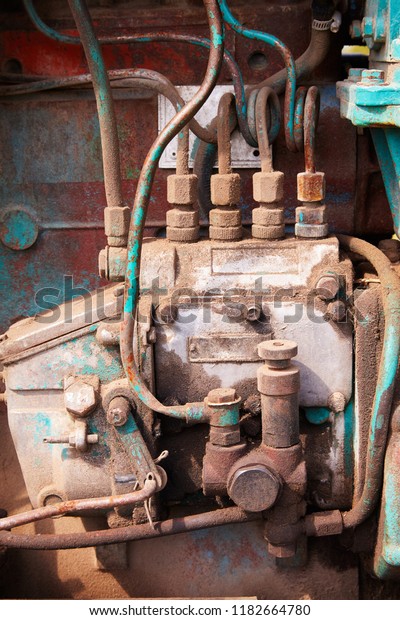 Close up of battered old farm tractor engine.\
Tractor machine