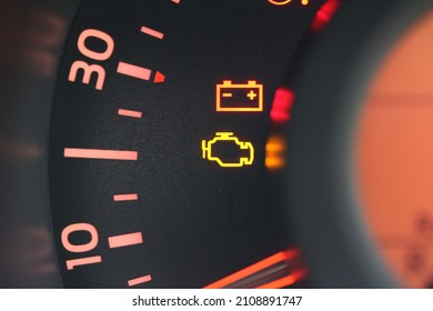 Close Up Of A Battery And Engine Warning Light In A New Car