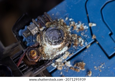 Close up battery terminals corrode dirty damaged problem, Old battery corrosion deteriorate leaking with blue acid powder. Service work by professional technicians concept.