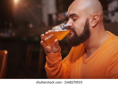 Close Up Of A Bearded Man Enjoying Drinking Delicious Cool Beer At The Pub, Copy Space