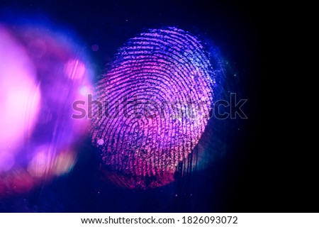 Close up beautiful abstract violet, red colored fingerprint on  background texture for design. Macro photography view.