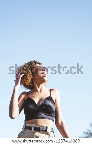 Similar – Brunette surfer woman in bikini standing with surfboard