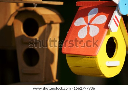 close up of beautiful colored wooden bird house