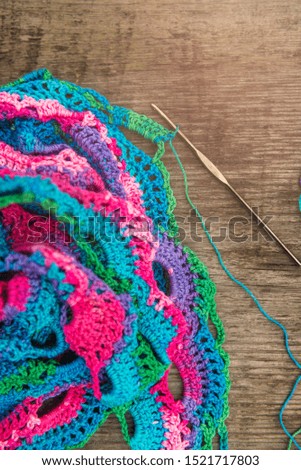 Close up of beautiful colorful shawl, it was knitted with crochet