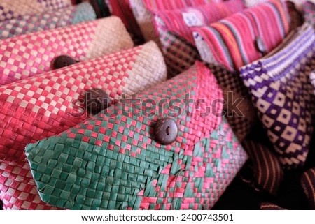 Close up of beautiful handmade colorful tais purse souvenirs in Timor-Leste, Southeast Asia