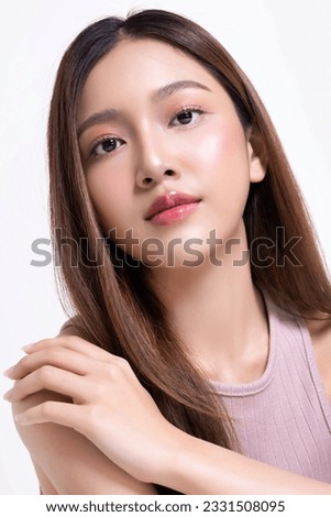 Close up beautiful longhair asian woman model with natural make up and clean fresh skin isolated on white background. Face care, Facial treatment, Cosmetology.