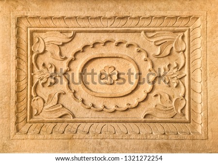 Close up of beautiful stone carved rectangular decorative frame. Decoration details of an old, historic Indian building.