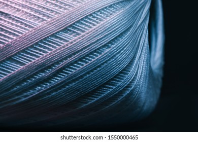 Close up beautiful tangle of thread in red and blue light background texture. Macro Photography view.
