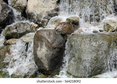 Close up of a beautiful waterfall falling over rocks