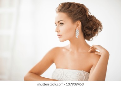 Close Up Of Beautiful Woman Wearing Shiny Diamond Earrings