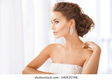 Close Up Of Beautiful Woman Wearing Shiny Diamond Earrings