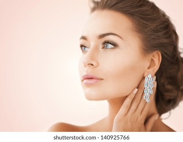 Close Up Of Beautiful Woman Wearing Shiny Diamond Earrings