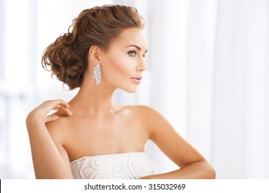 Close Up Of Beautiful Woman Wearing Shiny Diamond Earrings