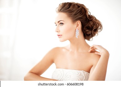 Close Up Of Beautiful Woman Wearing Shiny Diamond Earrings