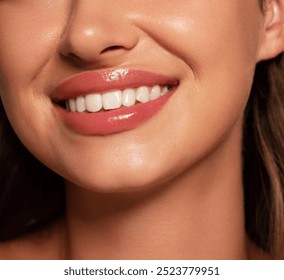 Close up of a beautiful young woman's face with fresh, smooth skin, pink lips, soft hair, a beautiful smile and white teeth _  Skin and body care  - Powered by Shutterstock