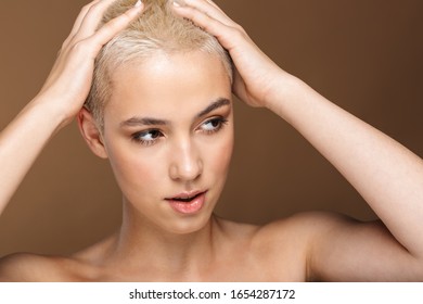 Oiled up blonde girl posing