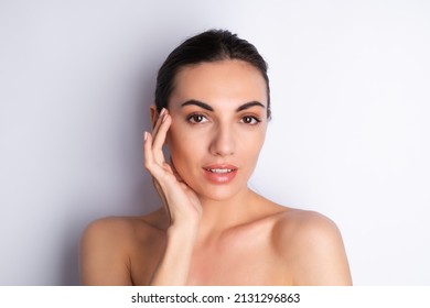 Close Beauty Portrait Of A Topless Woman With Perfect Skin And Natural Make-up, Plump Nude Lips, On A White Background	