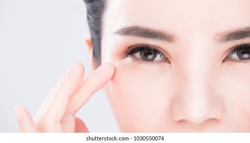 close up of beauty woman eye on the gray background