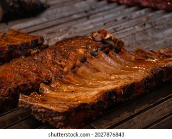 Close Up Of Beef Or Pork Ribs Roasted On American Style Grill.