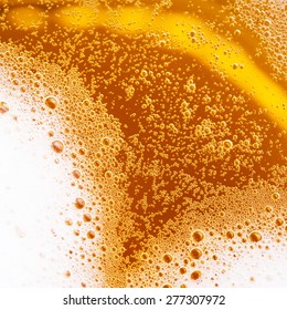 close up of beer with foam 