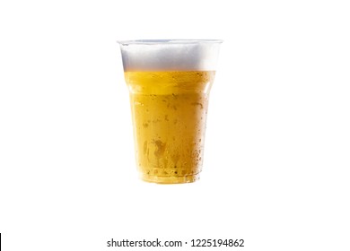 Close Up Of The Beer In Plastic Glass On White Background.