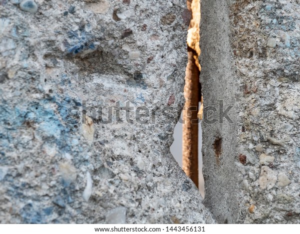 Close up of the Berlin Wall at the Berlin Wall\
Memorial, Berlin, Germany. Segments of the reinforced concrete wall\
have been left as a reminder of events leading up to the fall of\
the wall in 1989.