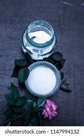 Close Up Of Best And Effective Home Remedy For Acne I.e. Baking Soda Mixed With Water Into A Thick Paste.On Wooden Surface With Rosa Flower.