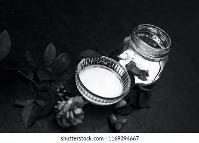 Close Up Of Best And Effective Home Remedy For Acne I.e. Baking Soda Mixed With Water Into A Thick Paste.On Wooden Surface With Rosa Flower.